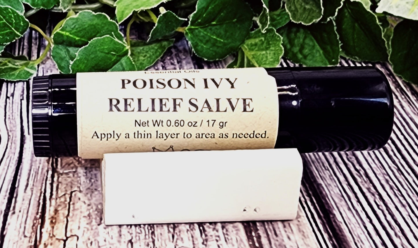 Roll-on bottle of Poison Ivy Relief Salve on a wooden surface with green leaves in the background