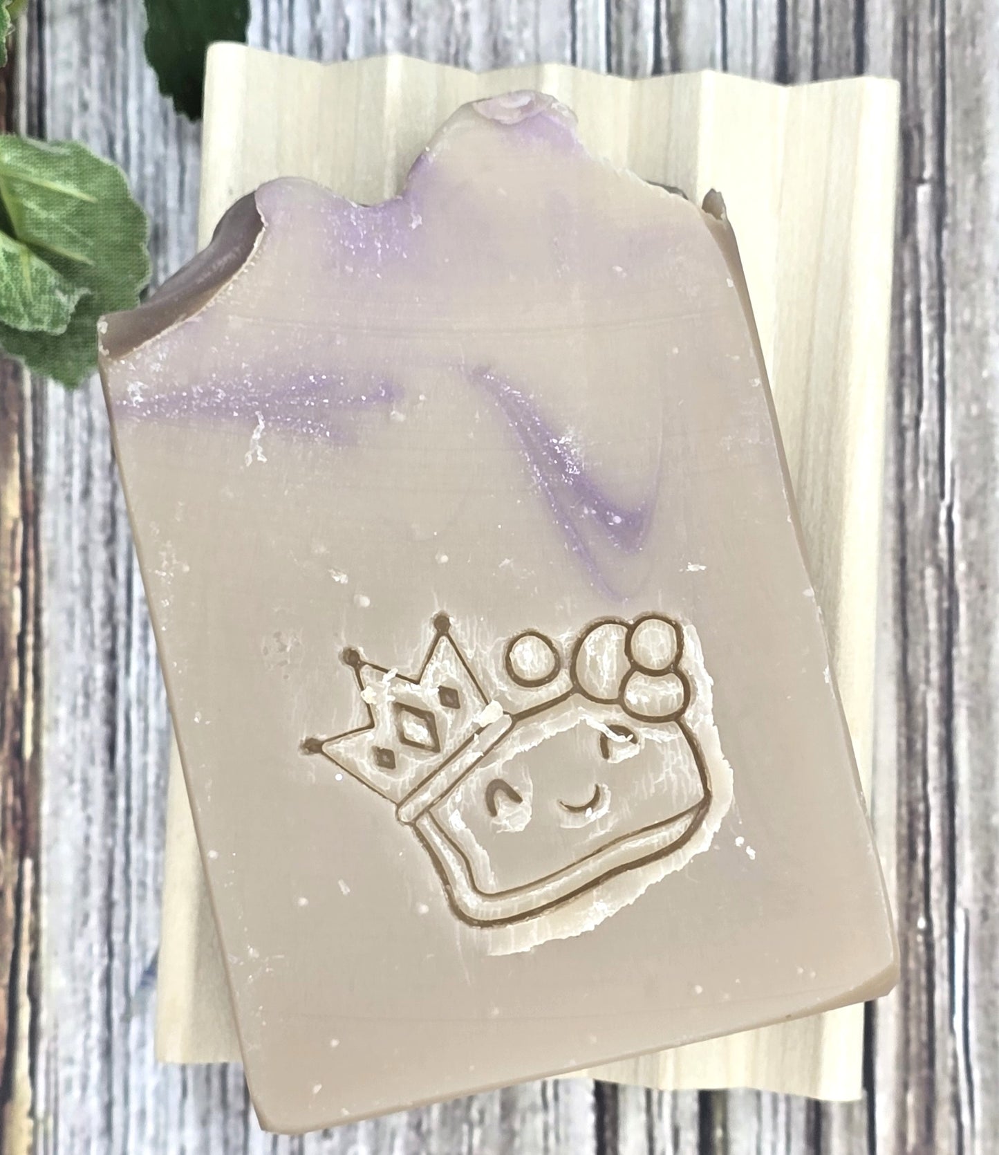 Soap with a princess design on a wooden surface