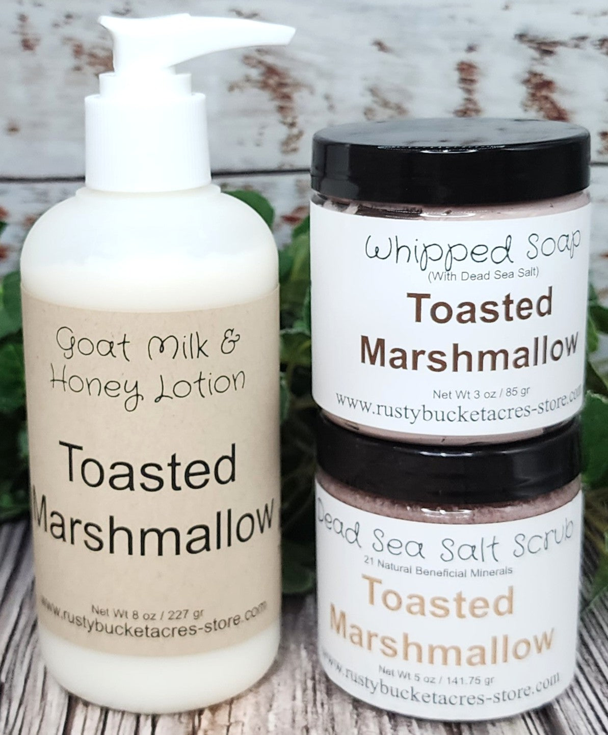 Shows an 8oz bottle of lotion with a 4 oz jar of whipped soap & dead sea salt scrub  