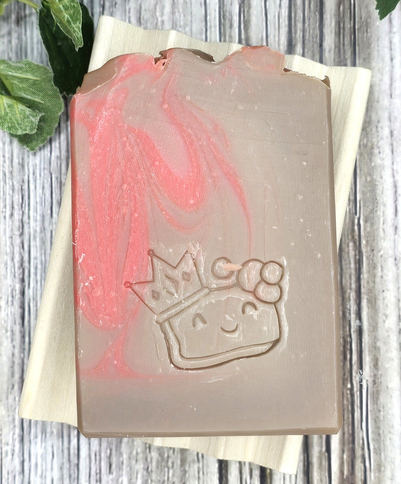 Bar of soap with a princess design on a wooden surface