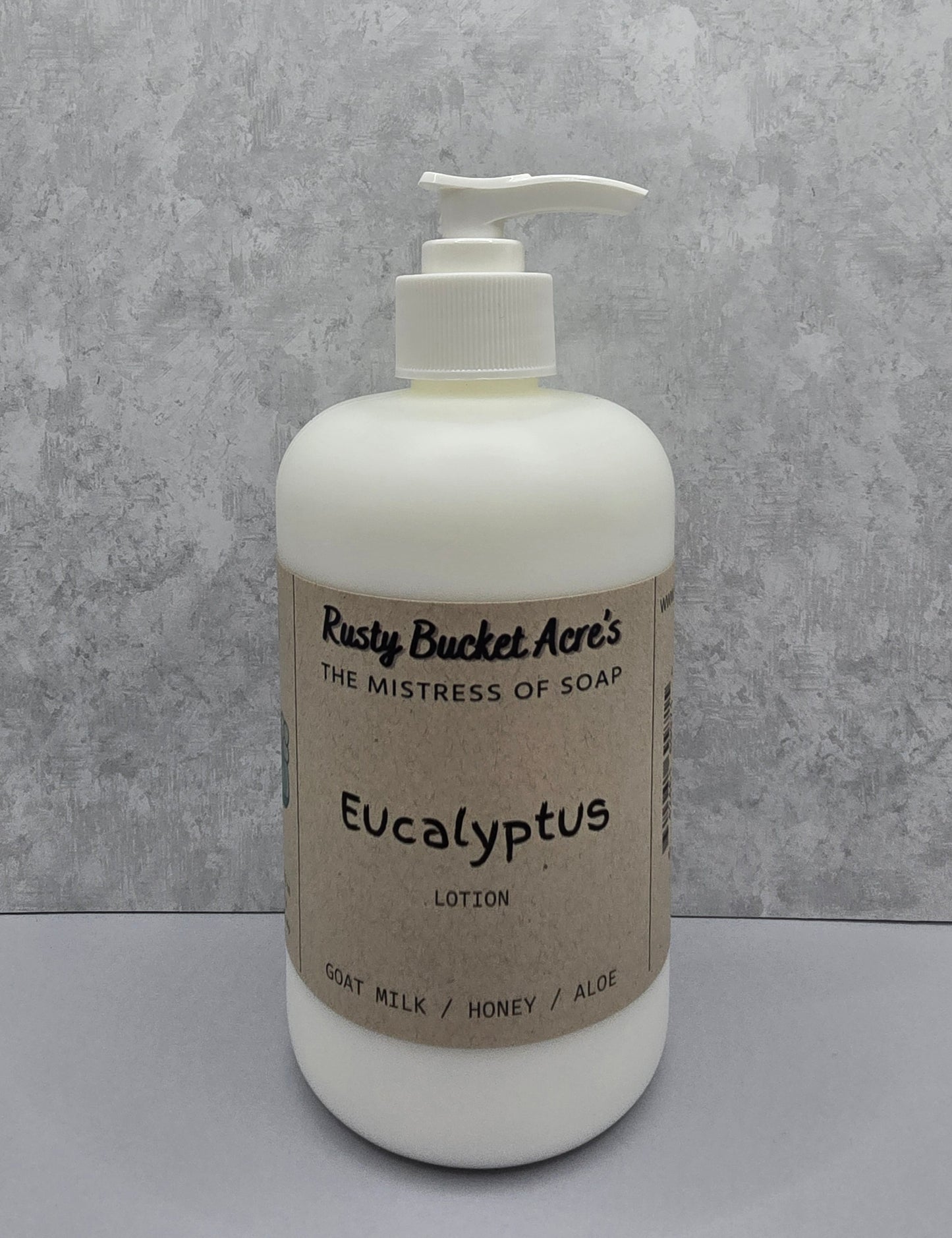 White lotion bottle with pump and 'Rusty Bucket Acres Eucalyptus' label on a gray background