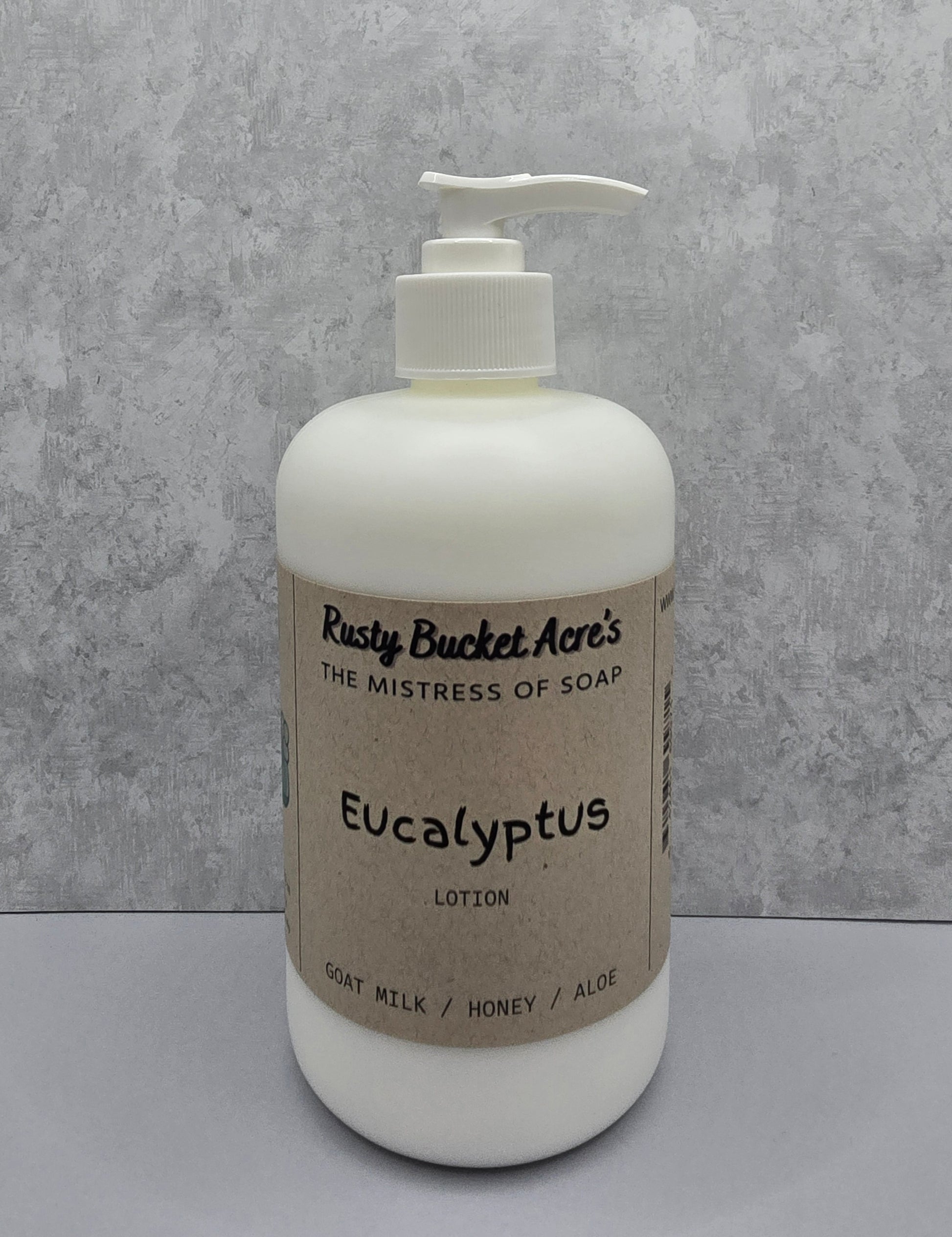 White lotion bottle with pump and 'Rusty Bucket Acres Eucalyptus' label on a gray background
