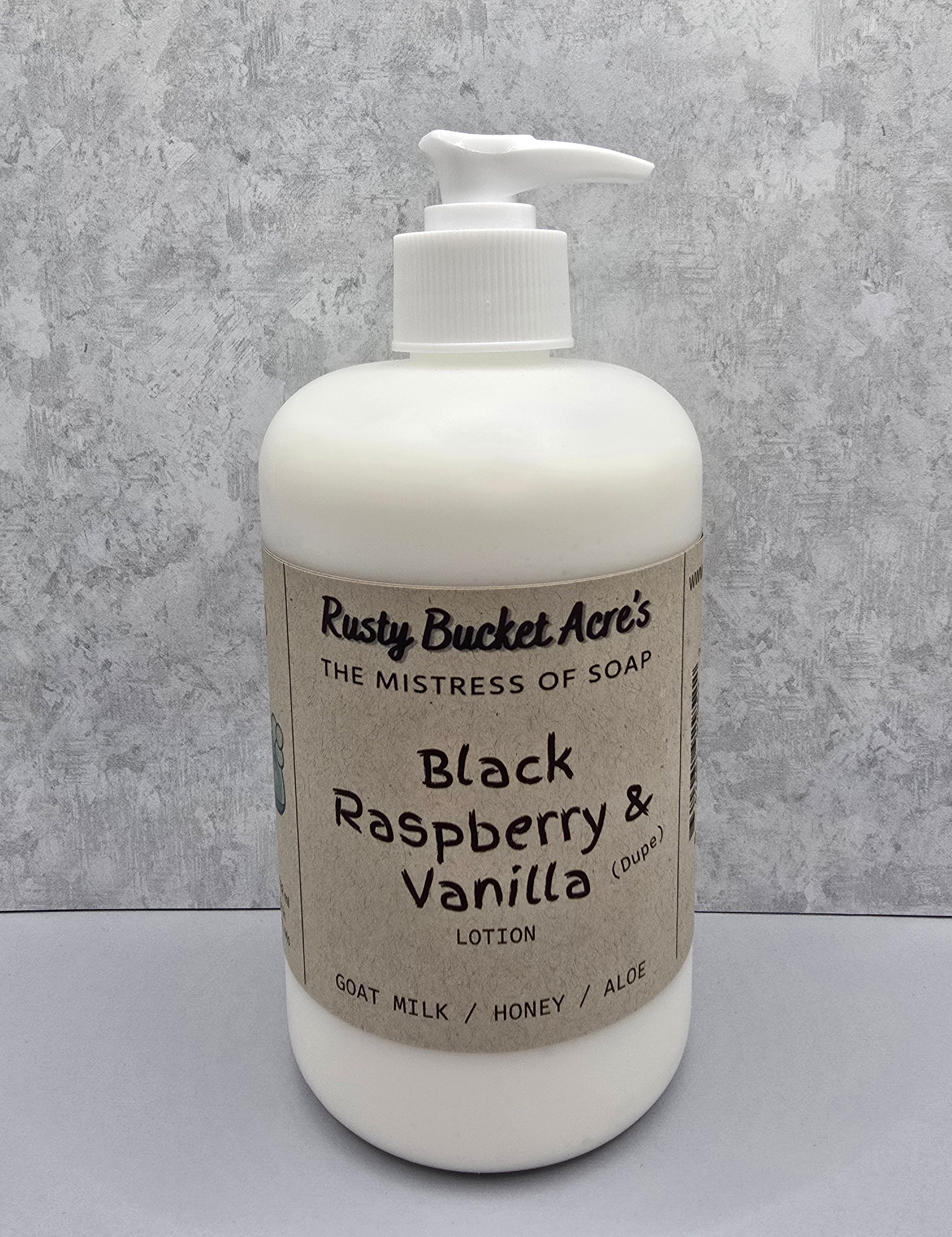 Lotion bottle with 'Rusty Bucket Acre's' label on a gray background